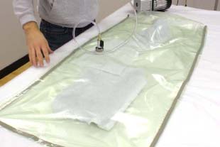 An ‘envelope bag’ completely encloses the part(s) instead of bagging film being pleated and taped to the mould’s flange